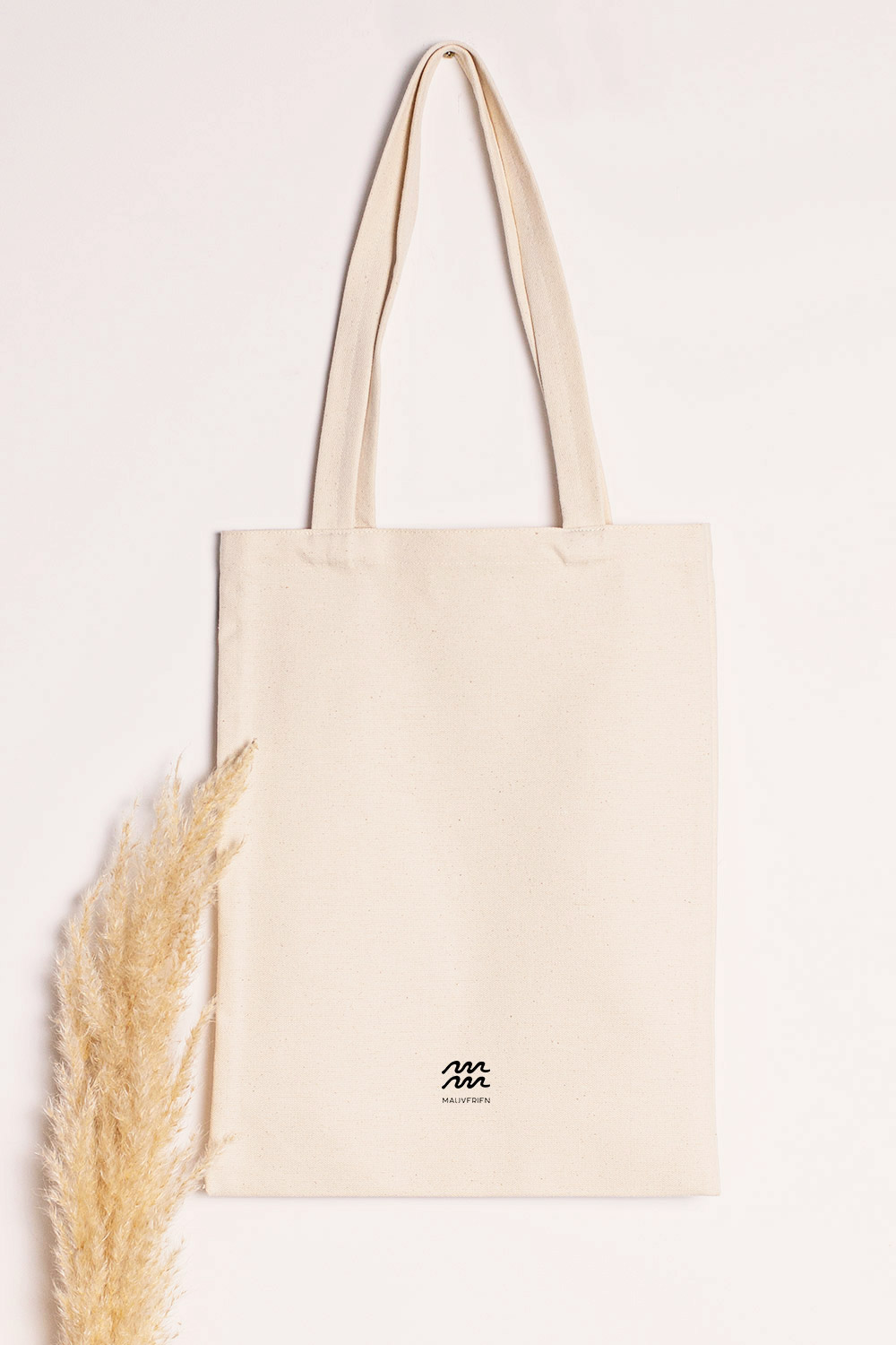 Back view of the tote bag printed with black Mauverien logo.