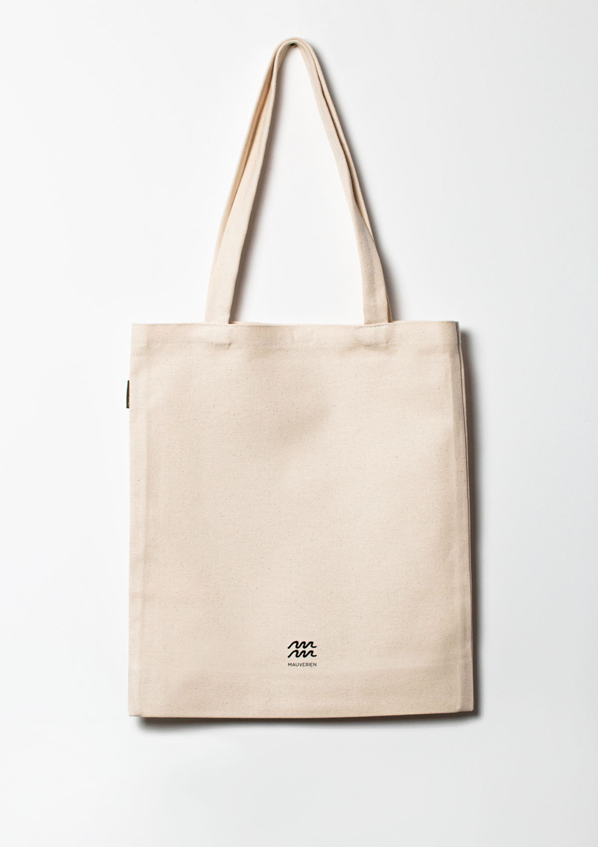 The back of the Eyes cotton tote bag with black logo Mauverien printed at the bottom in the center.
