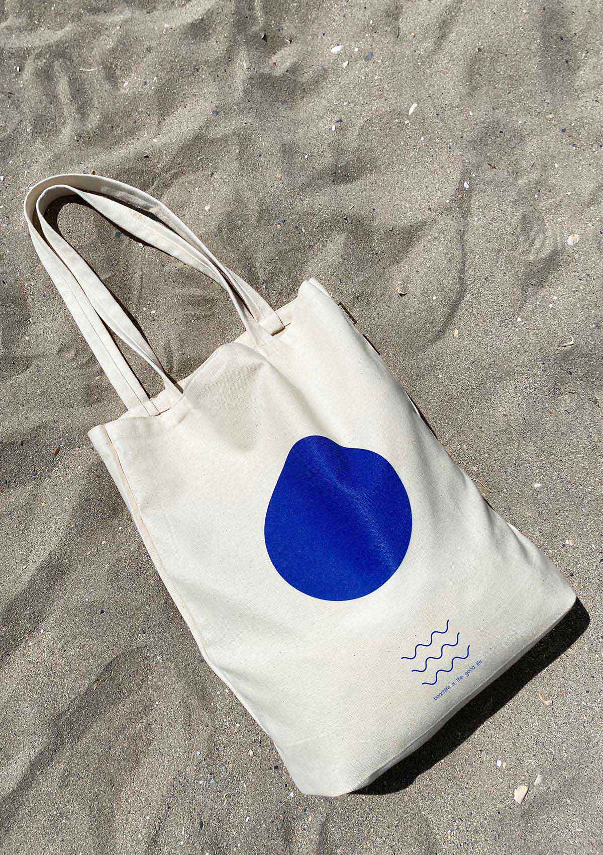 Made in Romania tote bag with blue dot printed on the front.