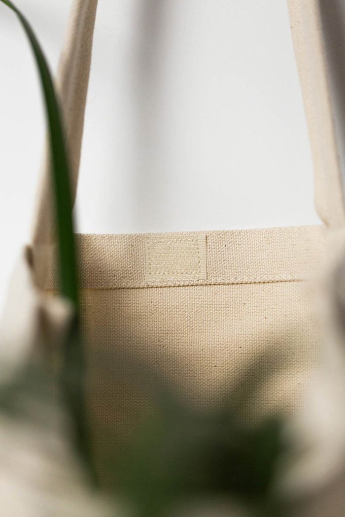 Inside detail of the blue story cotton tote bag with velcro by Mauverien.