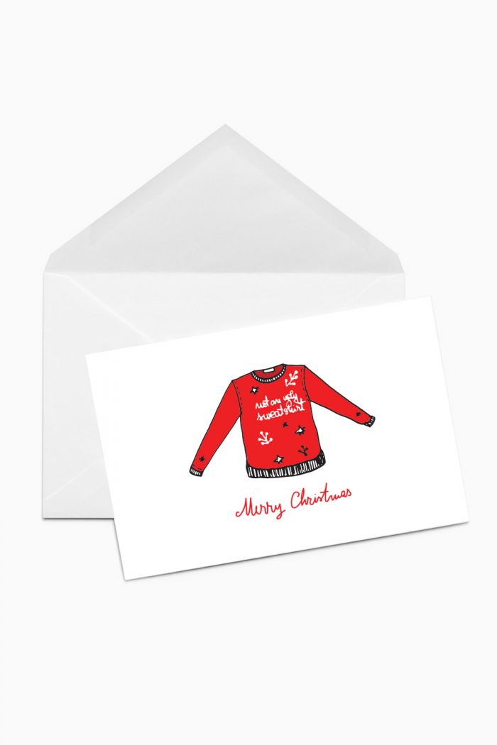 A Christmas card with a red sweatshirt with the message not an ugly sweatshirt.
