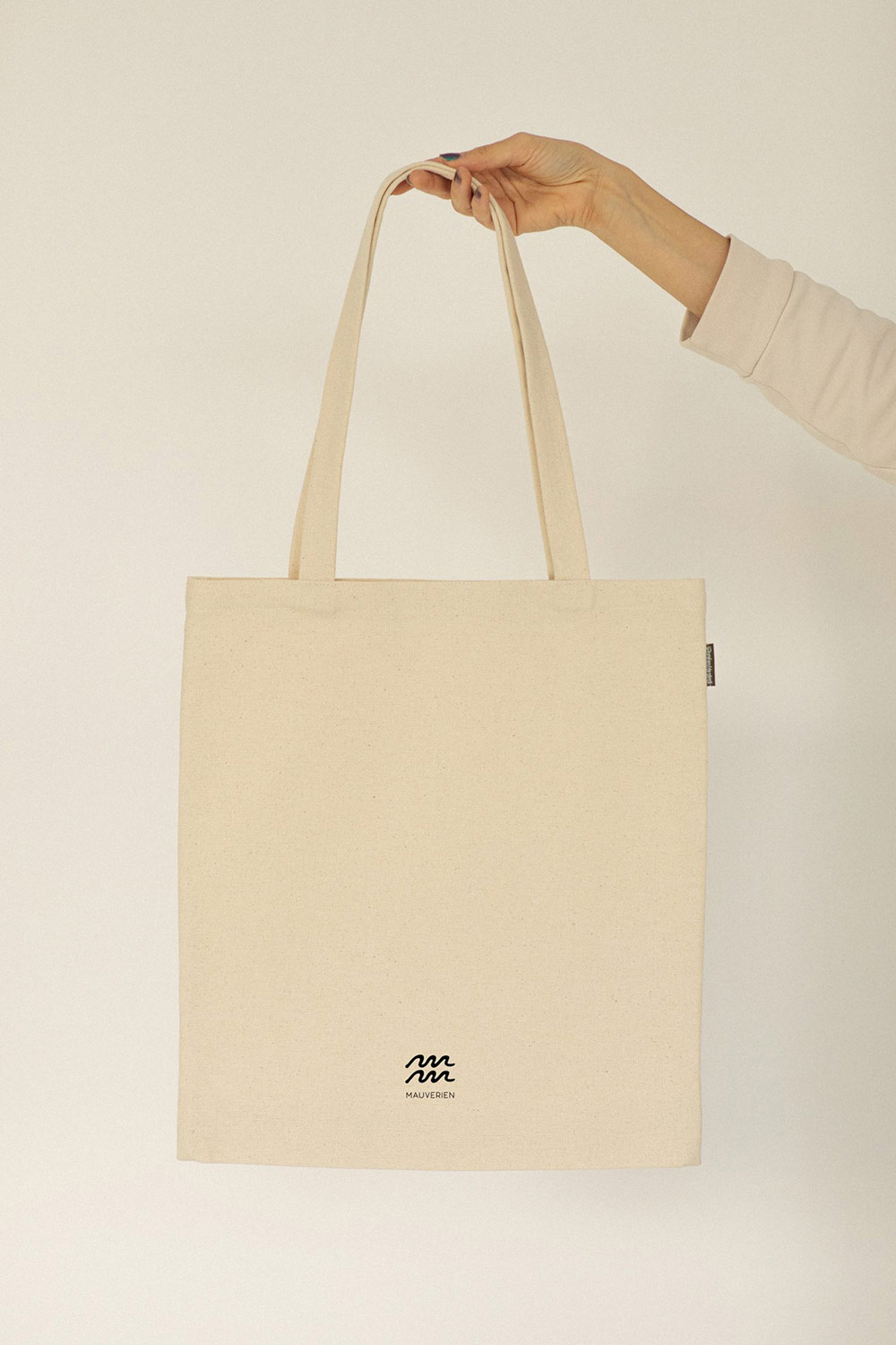 Back view of the blue fish cotton tote bag by Mauverien.
