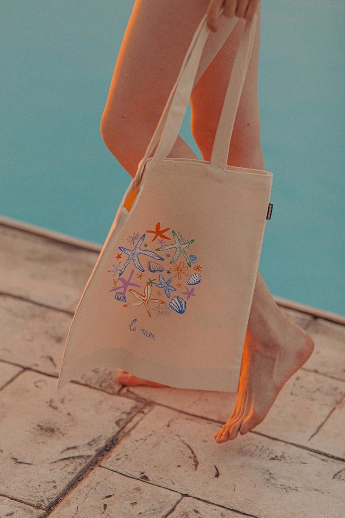 La mer cotton tote bag with multicoloured sea stars, shells by Mauverien.