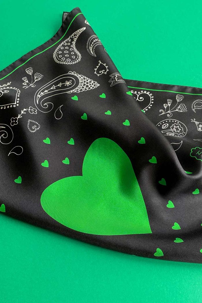 Green heart detail of black and green paisley twill silk scarf by Mauverien.