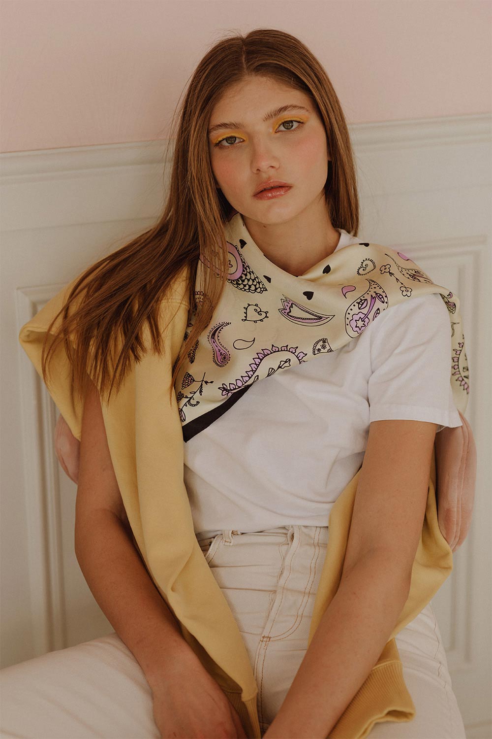 Woman wearing beige silk scarf and