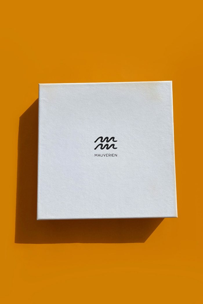 White square gift box with Mauverien logo for orange watercolour floral twill silk scarf.