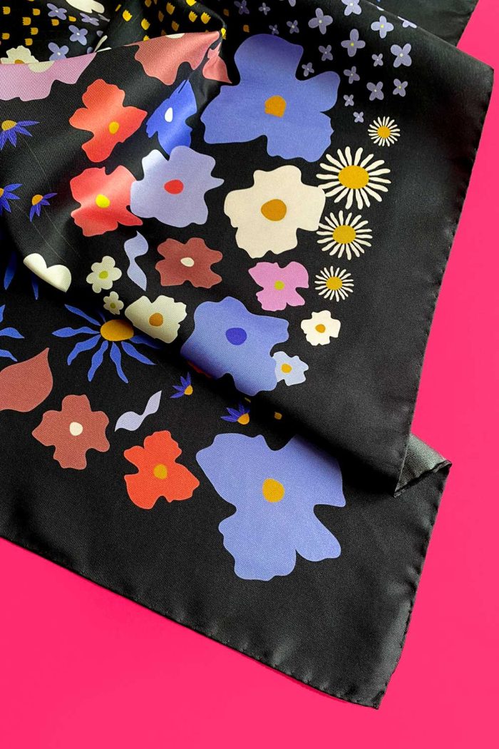 Corner detail of Black Large Silk Scarf with floral pattern.