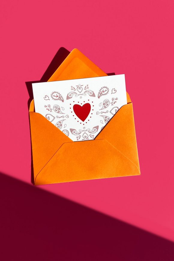 Greeting Card with Red Hearts & Paisley in orange envelope.