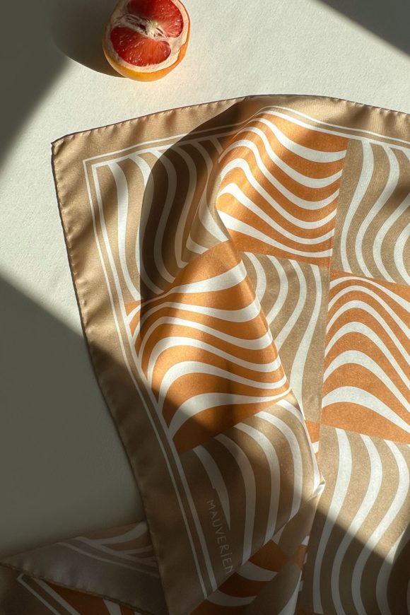 Orange and light brown silk scarf with wavy pattern by Romanian designer Mauverien.